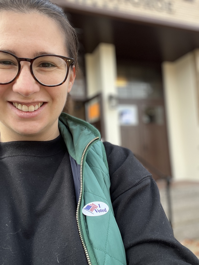 Advocate wearing an I Voted sticker