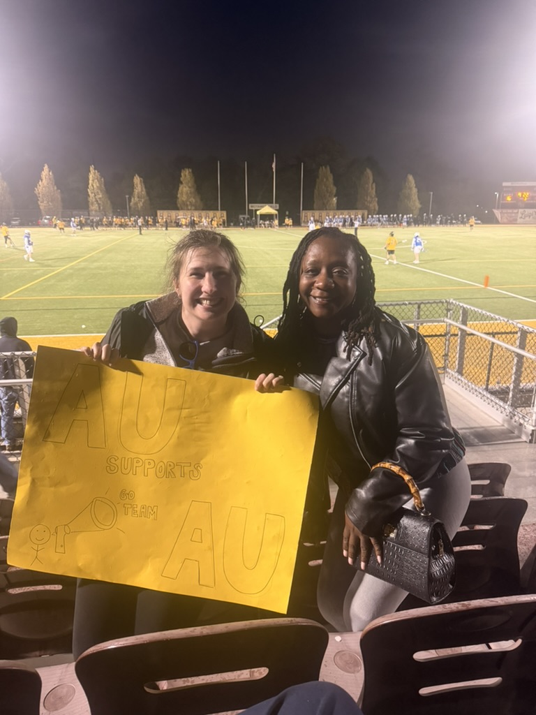 AU supports — lacrosse game supporters with sign